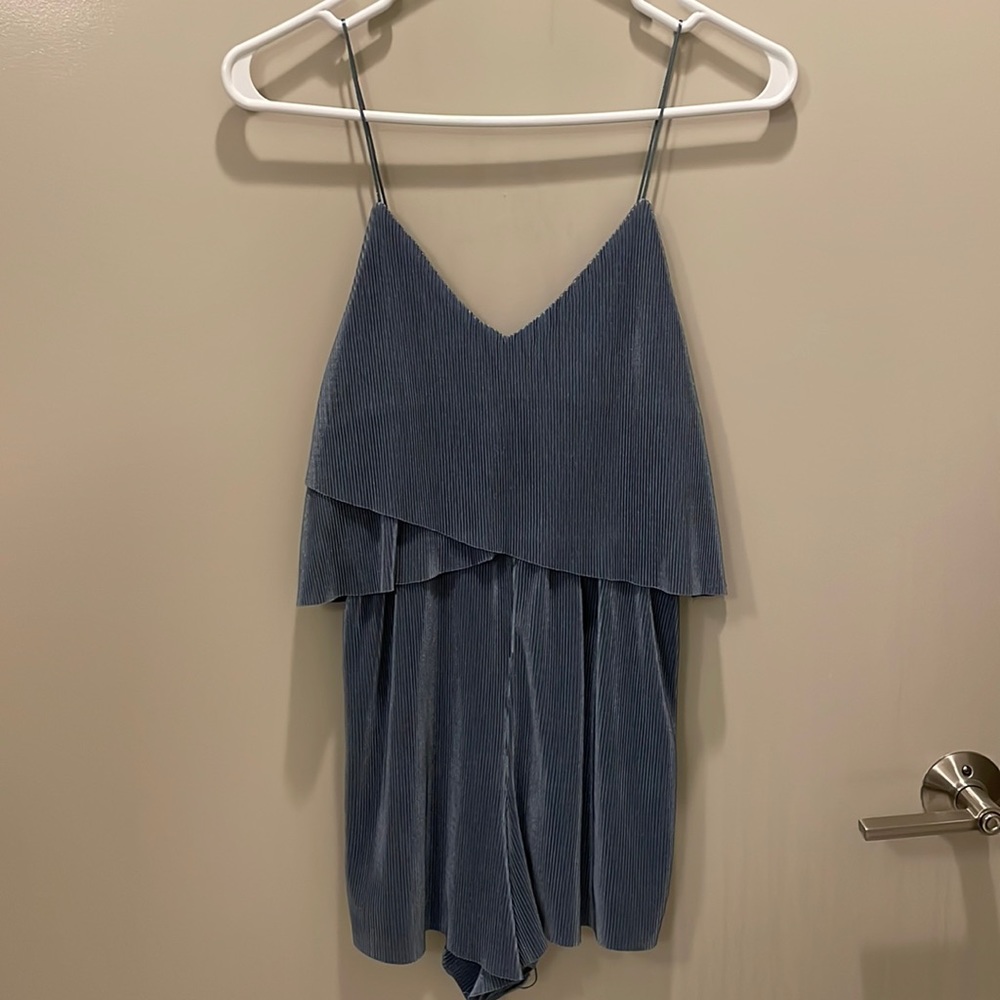 Adorable slinky romper perfect for dinner / night out. Accordion pleat romper.